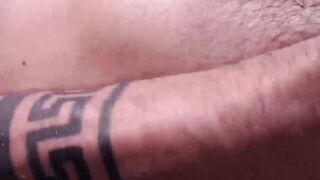 Slim Alexis Clark jacked his gigantic cock while working on his tan on the rooftops