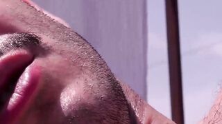 Slim Alexis Clark jacked his gigantic cock while working on his tan on the rooftops