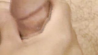 Hairy young guy tugs raging dick and cums all over the place