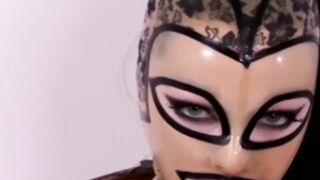 Masked babe in stockings spreads legs for solo masturbation