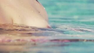 "Teenage Babe in Skimpy Swimwear Teases Viewers with Her Sexuality"