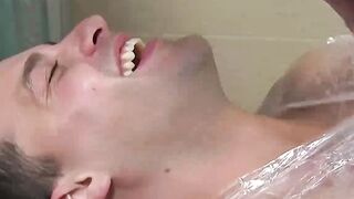 Helpless and bound man enjoys being tickled by his master