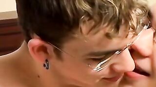 Attractive twink with glasses swallows a massive cock