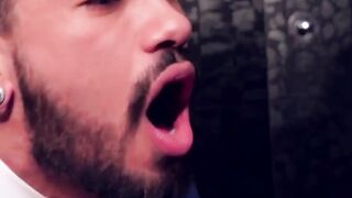 Two men in suits have sex in the toilet at work