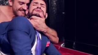 Two men in suits have sex in the toilet at work