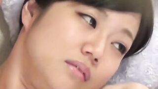 Young Japanese babe shares her couch masturbation session