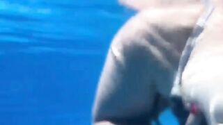 Teacher with Moisa Robert on summer vacation at the pool and the teacher tells moisa