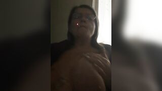 Milf Smokes and Caresses Big Boobies