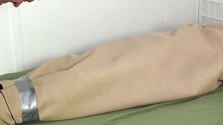 Mature master tickles feet and body of a bound slave hunk
