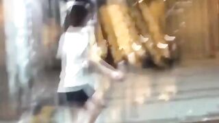 Asian girl challenges herself to see how long she can hold it