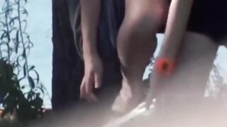 Voyeur films these Asian women making a puddle in the public park