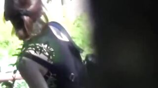 Voyeur films these Asian women making a puddle in the public park