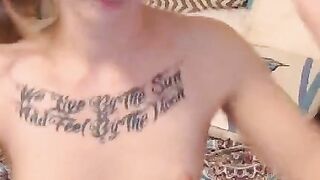 Tattooed babe teases her pussy on webcam