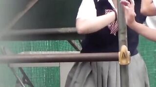 Japanese teen schoolgirls play and pee together outdoors