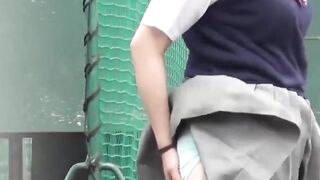 Japanese teen schoolgirls play and pee together outdoors