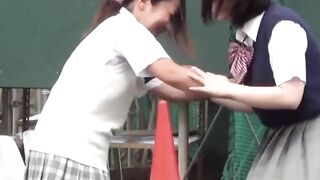 Japanese teen schoolgirls play and pee together outdoors