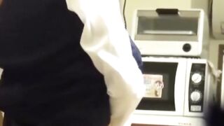 Japanese girl grinds pussy frantically on a kitchen chair