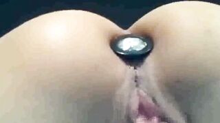 rubbing my wet slit with a plugged ass