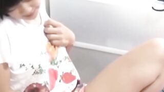 Solo Japanese hottie caught fingering tight pussy for fun