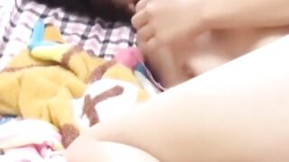Solo Japanese hottie caught fingering tight pussy for fun