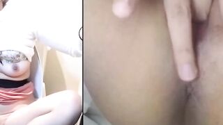 Japanese babe in toilet plunges fingers deep in twat