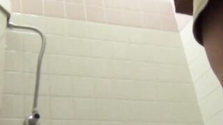 Camera watches Japanese ladies pee in a cramped restroom