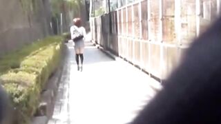 Voyeur cam catches Asian hottie pissing beside a car