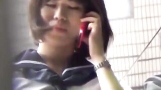 Sporty Japanese babe filmed playing in a tiny short skirt