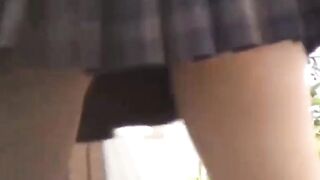 Sporty Japanese babe filmed playing in a tiny short skirt