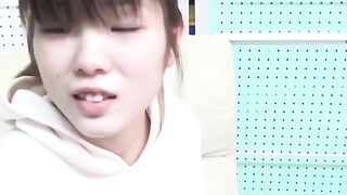Japanese cutie fills the container with her yellow warm pee