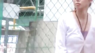 Slim college Japanese filmed by a voyeur pissing outside