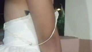 Tiny-titted Asian babe plays with herself outdoors