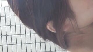 Japanese gal fills cup with yellow pee from hairy pussy