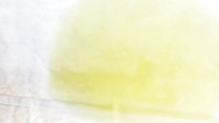 Witness a lovely lady fill a container with her warm urine
