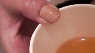 Japanese babes golden stream fills the container on camera
