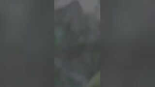 Rain wont stop Asian cutie fingering twat outdoors