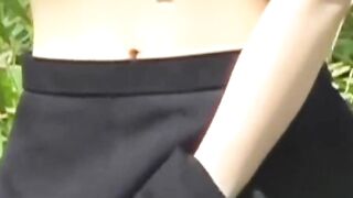 Uniformed girl rubs under her skirt and pees through panties