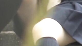 Uniformed girl rubs under her skirt and pees through panties