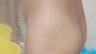 Voyeur films three petite Japanese spraying in a bathhouse