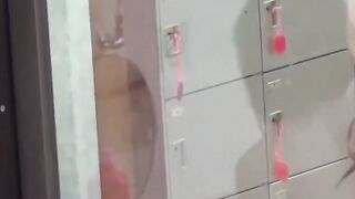 Voyeur films three petite Japanese spraying in a bathhouse