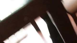 Girl plays with feet on tits
