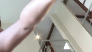 Girl plays with feet on tits