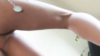 Girl plays with feet on tits
