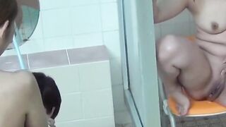 Naughty women piss on each other in a steamy bathhouse