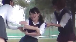 Three schoolgirls have fun pissing together outdoors