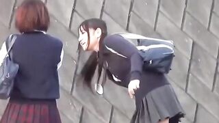 Three schoolgirls have fun pissing together outdoors