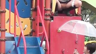 Naughty schoolgirls collect golden showers with an umbrella