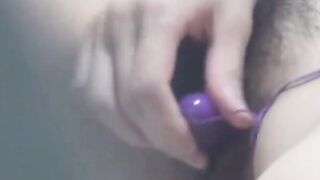 Origami girl fingers her hairy cunt then switches to vibrator
