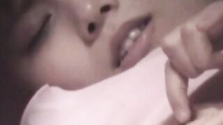 Horny Asian rubs shaved cunt while perv watches live