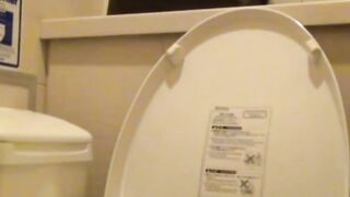 Voyeur films Japanese babe rubbing her pussy in ladies room